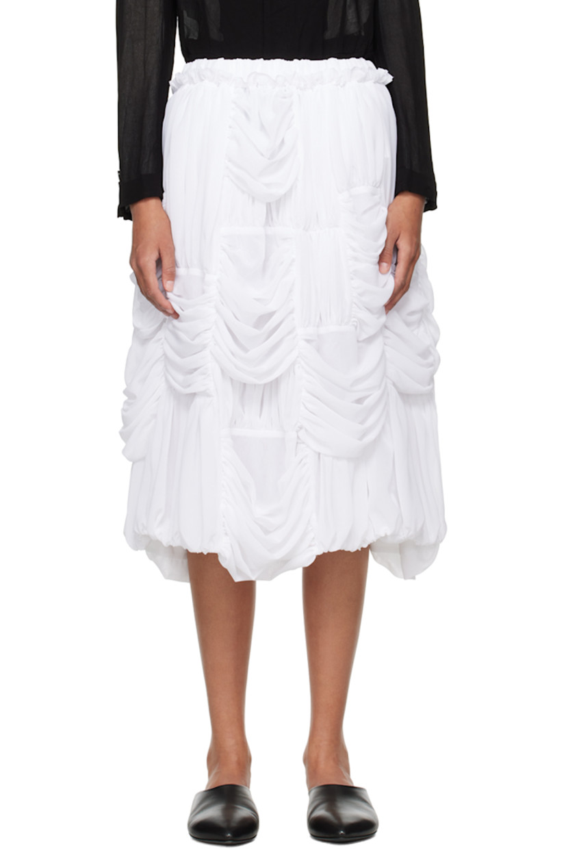 Polyester georgette skirt. Ruching throughout.

· Paneled construction
· Concealed drawstring at elasticized waistband
· Ruffled edge at waistband
· Two-pocket styling

Supplier color: White