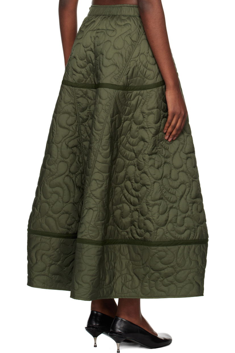 Padded and quilted nylon satin skirt.

· Partially elasticized waistband
· Two-pocket styling
· Flared hem
· Concealed zip closure at side seam
· Full cotton poplin lining

Supplier color: Contour quilt olive