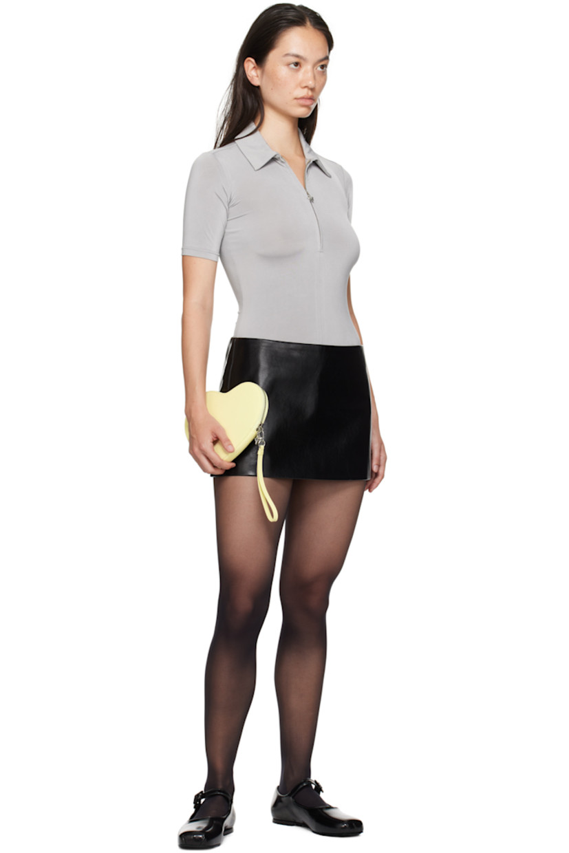 Grained faux-leather miniskirt. 

· Low-rise
· Zip closure at side seam
· Darts at back
· Full logo-woven viscose satin lining

Supplier color: Black
