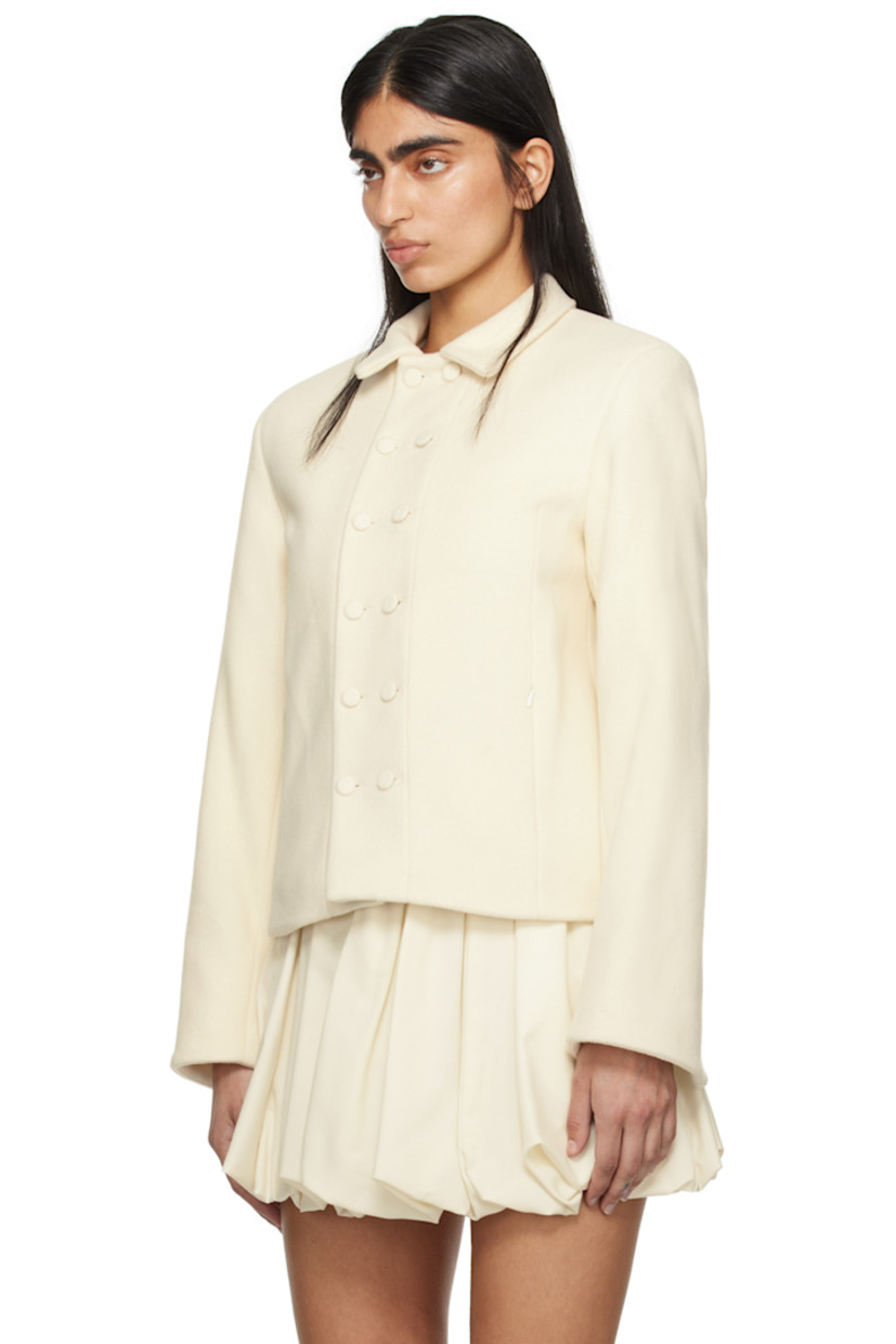Brushed wool melton jacket. 

· Spread collar
· Double-breasted button closure
· Zip pockets
· Padded shoulders
· Vented cuffs
· Full plain-woven cotton lining 

Part of the exclusive SSENSE Bridal capsule.

Supplier color: White