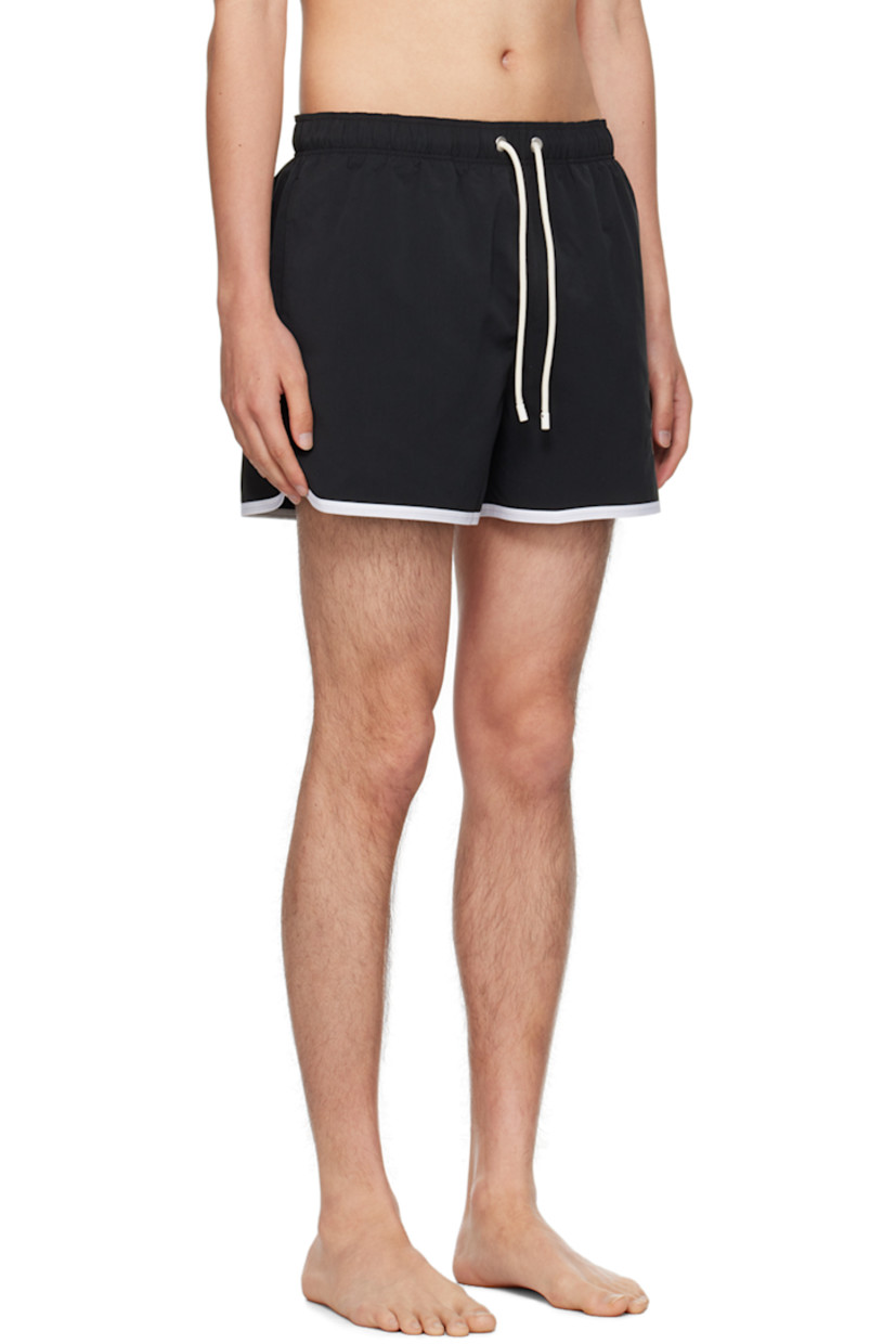 Polyester taffeta swim shorts.

· Drawstring at elasticized waistband
· Two-pocket styling
· Logo embroidered at front
· Piping at cuffs
· Integrated mesh shorts-style underlay

Supplier color: Black/Off white