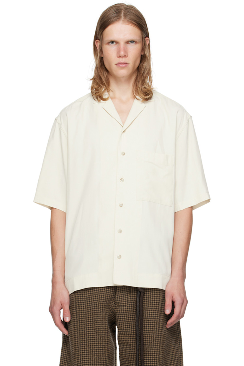 Oversized viscose twill shirt.

· Open spread collar
· Button closure
· Patch pocket 
· Vented side seams
· Dropped shoulders
· Logo flocked at back yoke

Supplier color: White