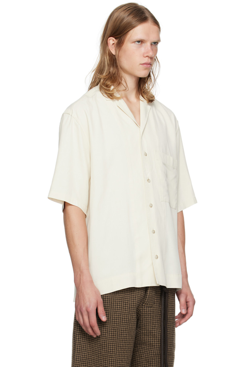 Oversized viscose twill shirt.

· Open spread collar
· Button closure
· Patch pocket 
· Vented side seams
· Dropped shoulders
· Logo flocked at back yoke

Supplier color: White