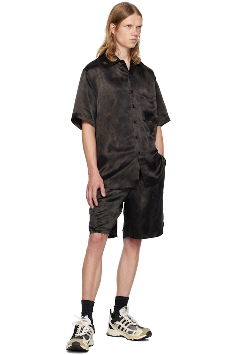 Acetate satin shirt. Paint splatter effect printed throughout.

· Spread collar
· Button closure
· Patch pocket
· Shirttail hem
· Dropped shoulders

Supplier color: Black