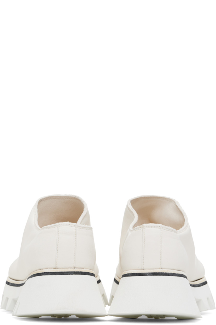 Grained horse leather slip-on loafers in white.

· Foam rubber platform midsole
· Treaded Vibram® Vi-Lite rubber sole
· Platform: H1.75"

Supplier color: White