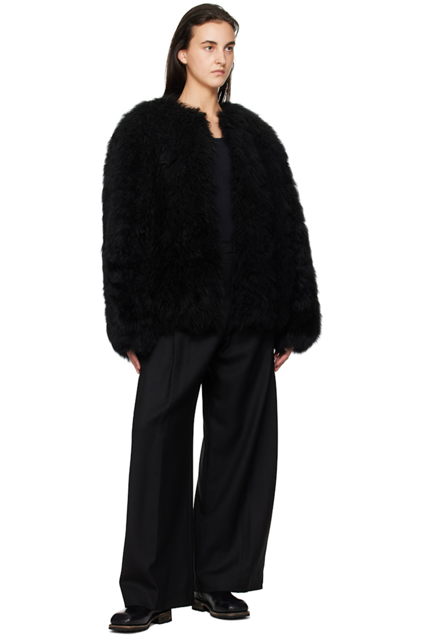 Lambskin fur jacket.

· Round neck
· Hook-eye closure
· Bungee-style drawstring at hem
· Logo patch at back collar
· Full satin lining

Supplier color: Black