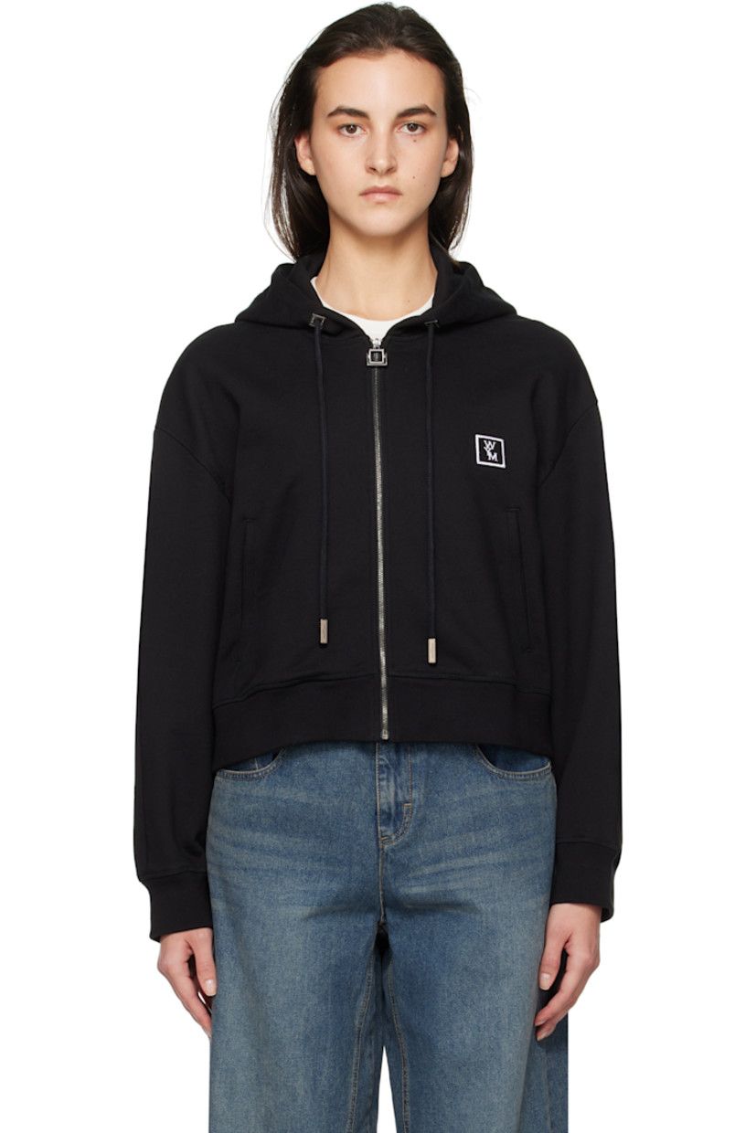 French terry hoodie.

· Drawstring at hood
· Zip closure
· Embroidered logo patch at chest
· Welt pockets
· Rib-knit hem and cuffs
· Dropped shoulders
· Logo hardware at back collar
· Logo printed at back

Supplier color: Black