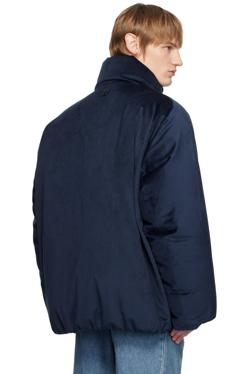Down-filled polyester velour jacket.

· Stand collar
· Two-way zip closure
· Logo hardware at front and back
· Welt pockets
· Bungee-style drawstring at elasticized hem
· Elasticized cuffs
· Welt pocket at interior
· Full quilted ripstop lining

Supplier color: Navy

Fill 1: 90% goose down, 10% goose feather.