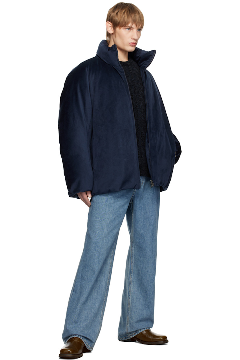 Down-filled polyester velour jacket.

· Stand collar
· Two-way zip closure
· Logo hardware at front and back
· Welt pockets
· Bungee-style drawstring at elasticized hem
· Elasticized cuffs
· Welt pocket at interior
· Full quilted ripstop lining

Supplier color: Navy

Fill 1: 90% goose down, 10% goose feather.