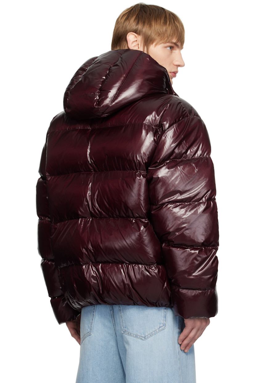 Down-filled and quilted nylon laqué jacket.

· Press-stud throat guard at detachable hood
· Stand collar
· Press-stud closure
· Logo stamp at chest
· Zip pockets
· Elasticized hem and cuffs
· Logo hardware at back
· Welt pockets at interior
· Full satin lining
· Logo-engraved silver-tone hardware

Supplier color: Red

Fill: 90% goose down, 10% goose feather.