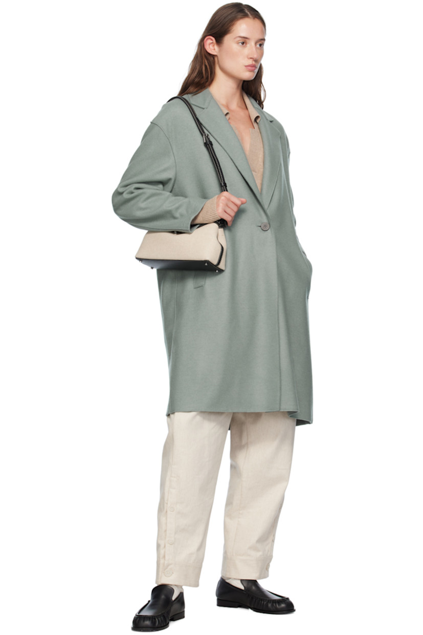 Oversized mulesing-free virgin wool- and silk-blend melton coat. Raw edges throughout. 

· Notched lapel
· Button closure
· Welt pockets
· Dropped shoulders
· Unlined

Supplier color: Sage green