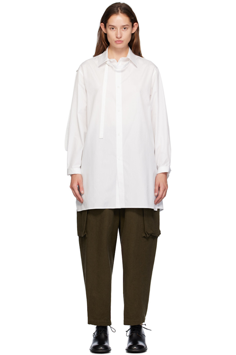 Cotton poplin shirt. 

· Spread collar 
· Integrated cinch strap at collar and sleeves 
· Button closure
· Droptail hem 
· Single-button barrel cuffs
· Box pleat at back yoke 

Supplier color: White