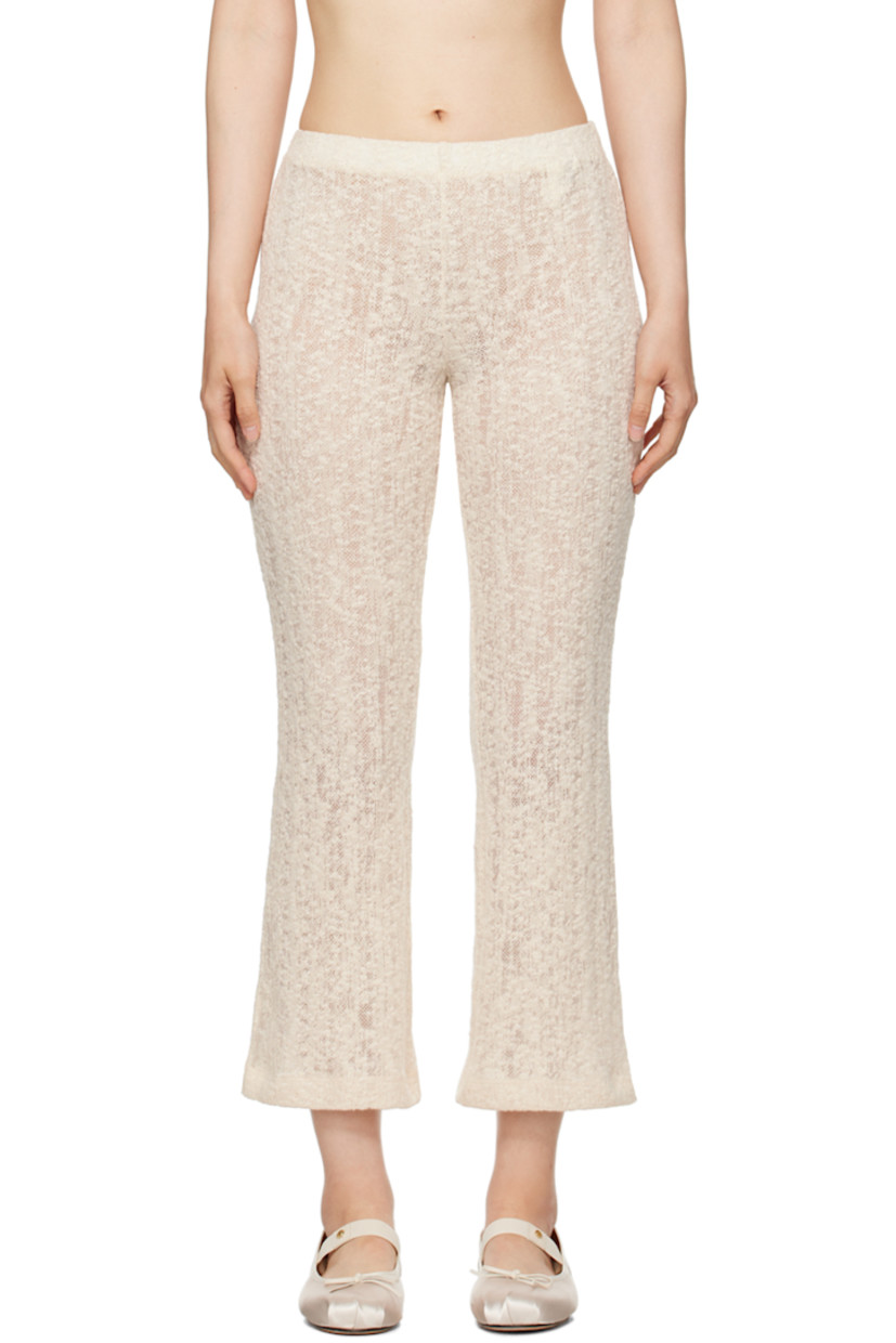 Semi-sheer lightweight textured knit organic cotton-blend lounge pants. 

· Elasticized waistband
· Cropped legs 
· Flared cuffs

Supplier color: Off white
