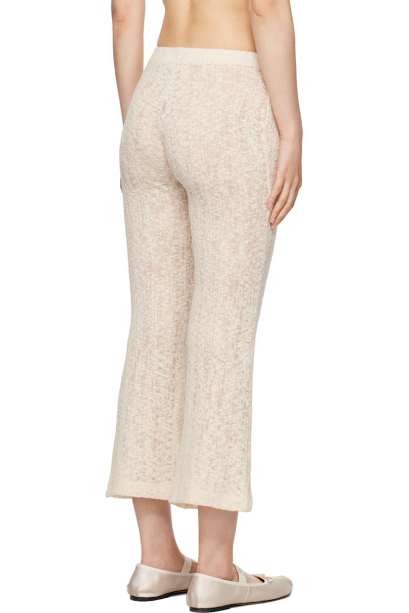 Semi-sheer lightweight textured knit organic cotton-blend lounge pants. 

· Elasticized waistband
· Cropped legs 
· Flared cuffs

Supplier color: Off white