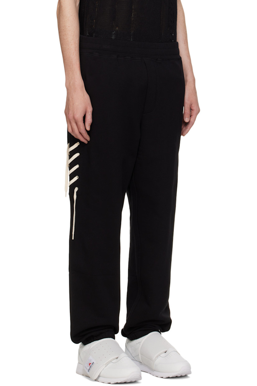 Organic cotton French Terry sweatpants.

· Concealed drawstring at elasticized waistband
· Two-pocket styling
· Lace-up detailing at outseam
· Elasticized cuffs

Supplier color: Black/Cream