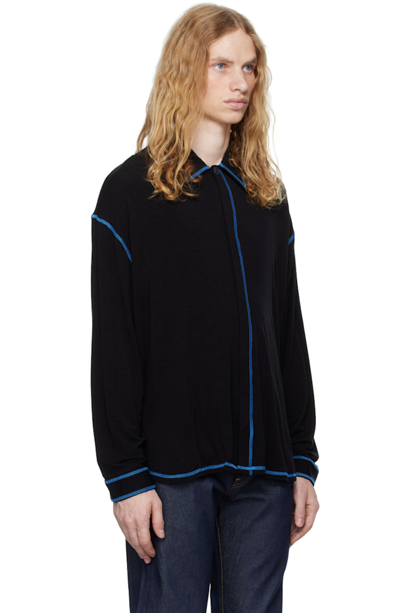 Stretch merino wool-blend jersey shirt. Flatlock seams throughout. 

· Spread collar
· Button closure 
· Droptail hem
· Single-button barrel cuffs
· Contrast stitching in blue

Supplier color: Black