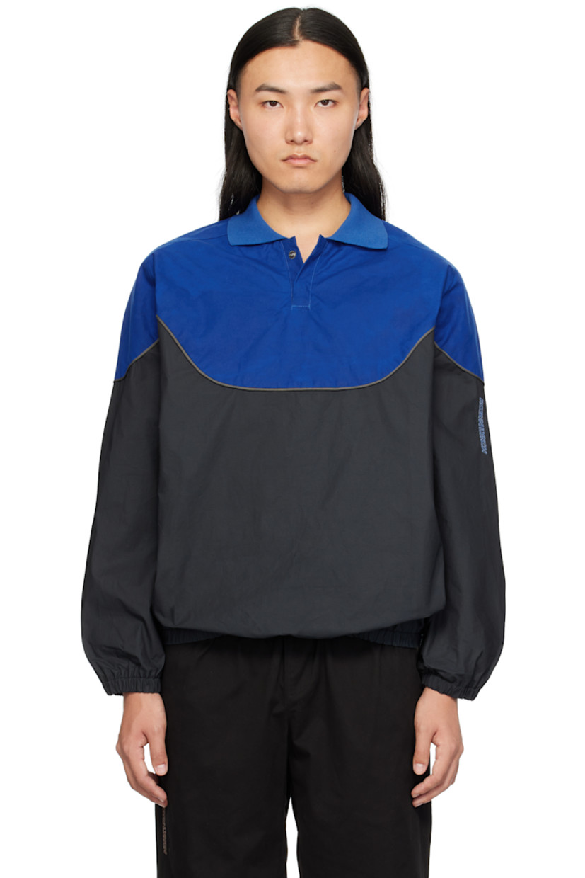 Cotton-blend ripstop polo. Piping throughout.

· Rib-knit spread collar
· Two-button press-stud placket
· Elasticized hem and cuffs

Supplier color: Blue/Black