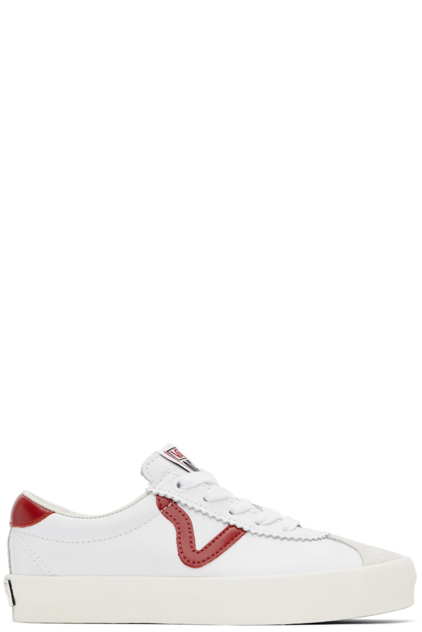 Low-top buffed leather and suede sneakers in white.

· Serrated edges at lace-up closure
· Padded tongue and collar
· Logo patch at padded tongue
· Padded collar
· Logo appliqué at outer side
· Grained leather and canvas lining
· Rubberized logo patch at heel
· Treaded rubber sole

Supplier color: Red