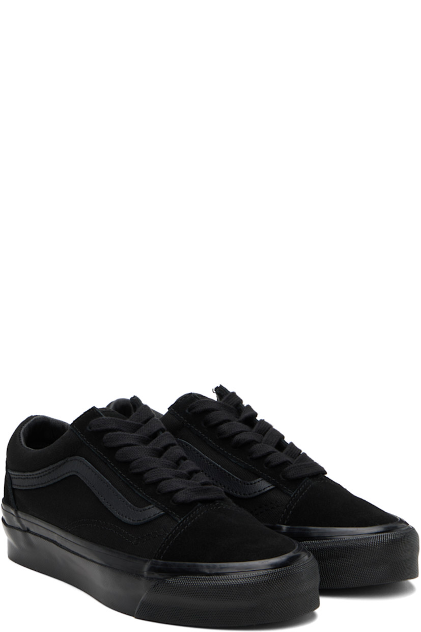 Low-top 8 oz canvas and suede sneakers in black.

· Lace-up closure
· Padded tongue and collar
· Grained leather Sidestripe™ at sides
· Padded Sola ADC foam footbed
· Buffed leather and canvas lining
· Rubberized logo patch at heel
· Treaded rubber sole

Supplier color: Black