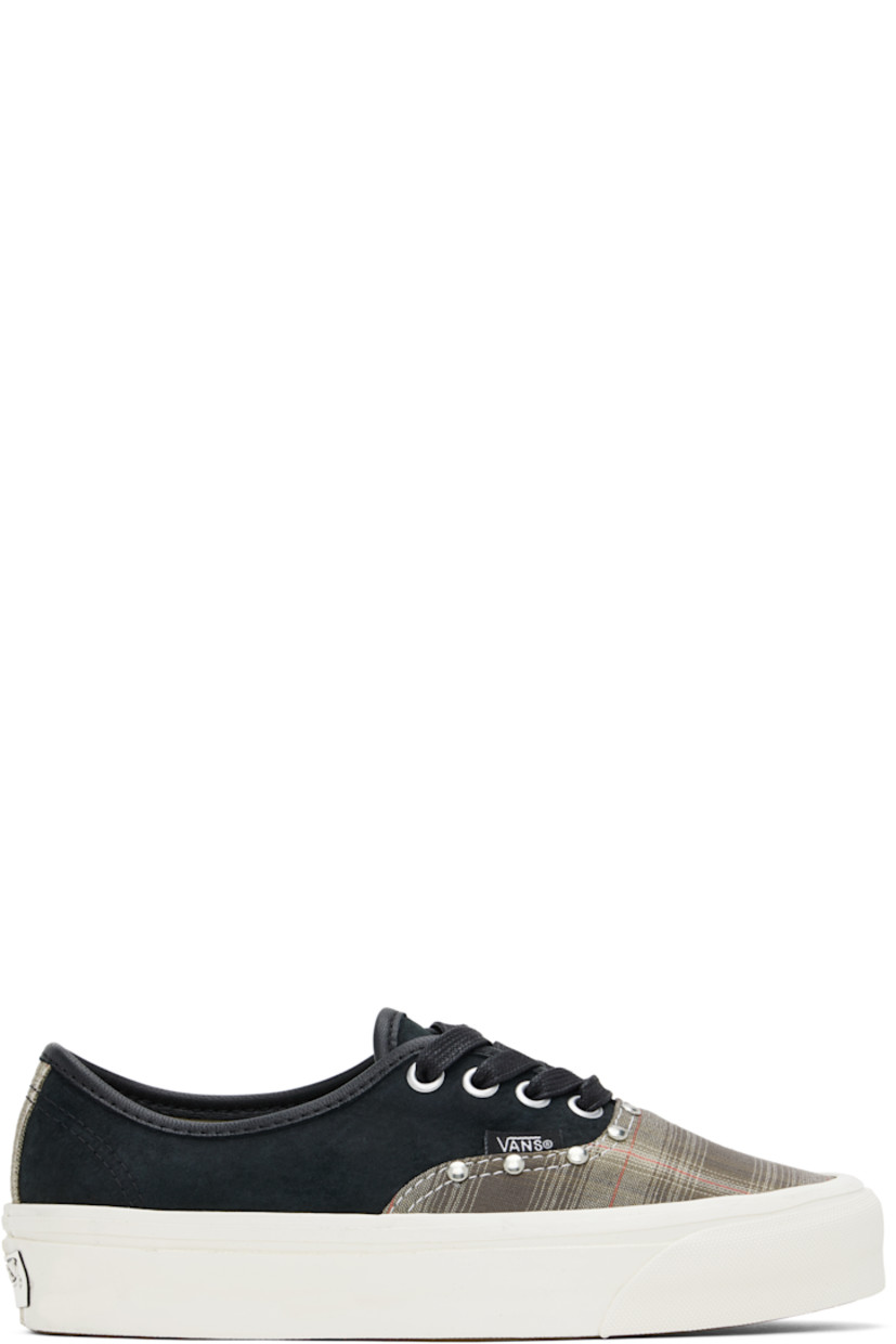 Low-top canvas and suede sneakers in black and khaki.

· Check pattern throughout
· Studs at vamp
· Lace-up closure
· Logo flag at outer side
· Canvas lining
· Rubberized logo patch at heel
· Treaded rubber sole

Supplier color: Prep plaid olive green