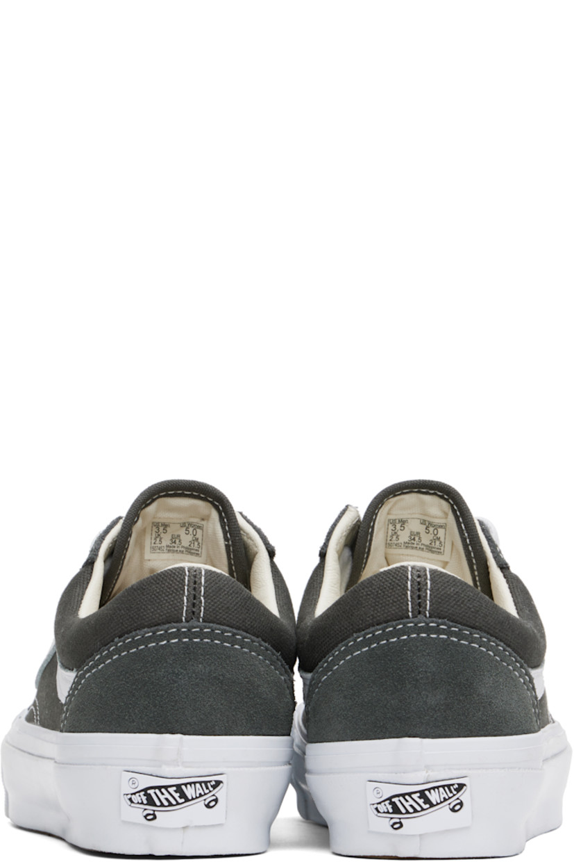 Low-top 8 oz canvas and suede sneakers in gray. 

· Lace-up closure
· Padded tongue and collar
· Grained leather Sidestripe™ 
· Padded Sola ADC foam footbed
· Buffed leather lining
· Rubberized logo patch at heel midsole
· Treaded rubber sole
· Contrast stitching in white

Supplier color: Gunmetal
