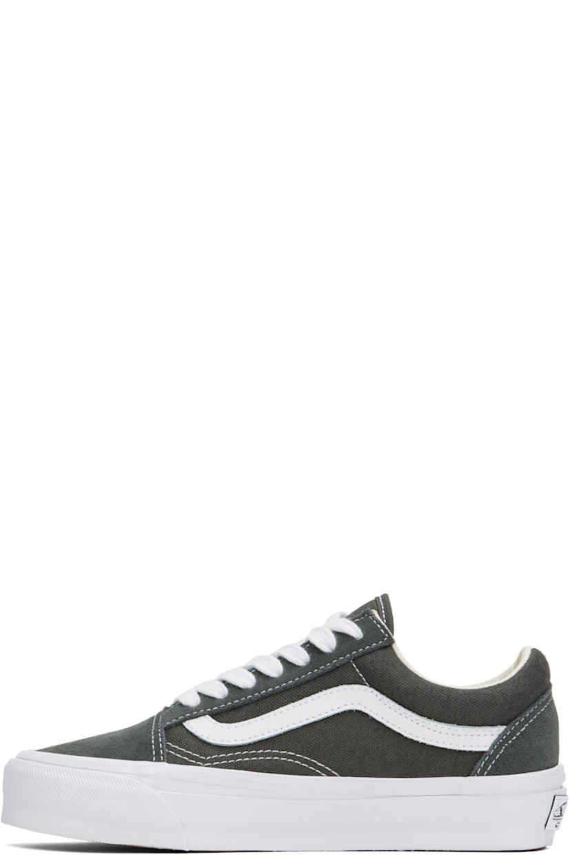 Low-top 8 oz canvas and suede sneakers in gray. 

· Lace-up closure
· Padded tongue and collar
· Grained leather Sidestripe™ 
· Padded Sola ADC foam footbed
· Buffed leather lining
· Rubberized logo patch at heel midsole
· Treaded rubber sole
· Contrast stitching in white

Supplier color: Gunmetal