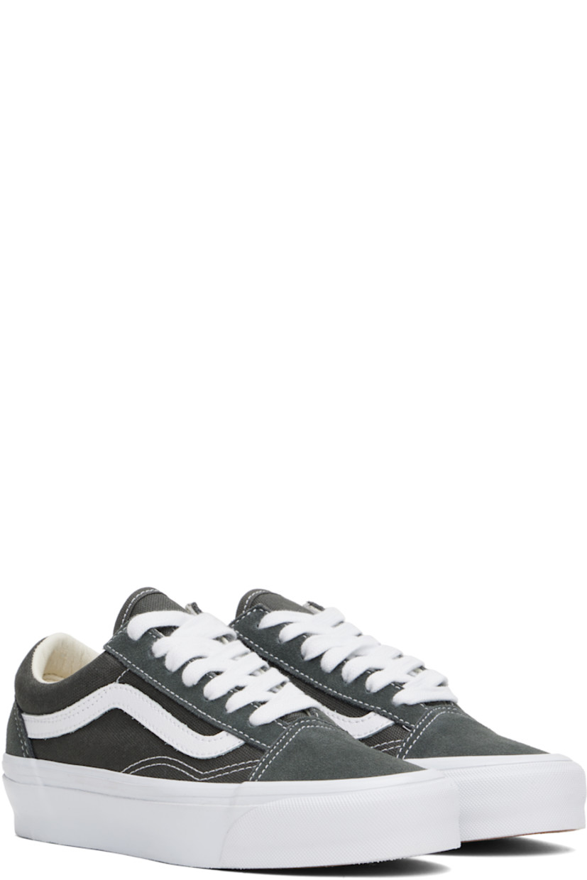 Low-top 8 oz canvas and suede sneakers in gray. 

· Lace-up closure
· Padded tongue and collar
· Grained leather Sidestripe™ 
· Padded Sola ADC foam footbed
· Buffed leather lining
· Rubberized logo patch at heel midsole
· Treaded rubber sole
· Contrast stitching in white

Supplier color: Gunmetal