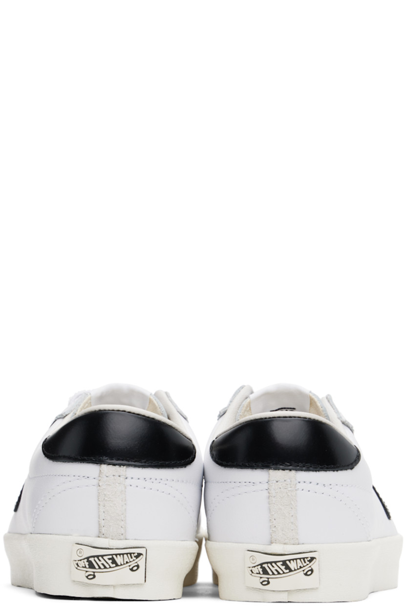 Low-top suede and buffed leather sneakers in white.

· Serrated detailing at lace-up closure
· Logo patch at padded tongue
· Grained leather Sidestripe™ at outer side
· Padded Sola ADC foam footbed
· Grained leather lining
· Rubberized logo patch at heel
· Treaded rubber sole

Supplier color: Black