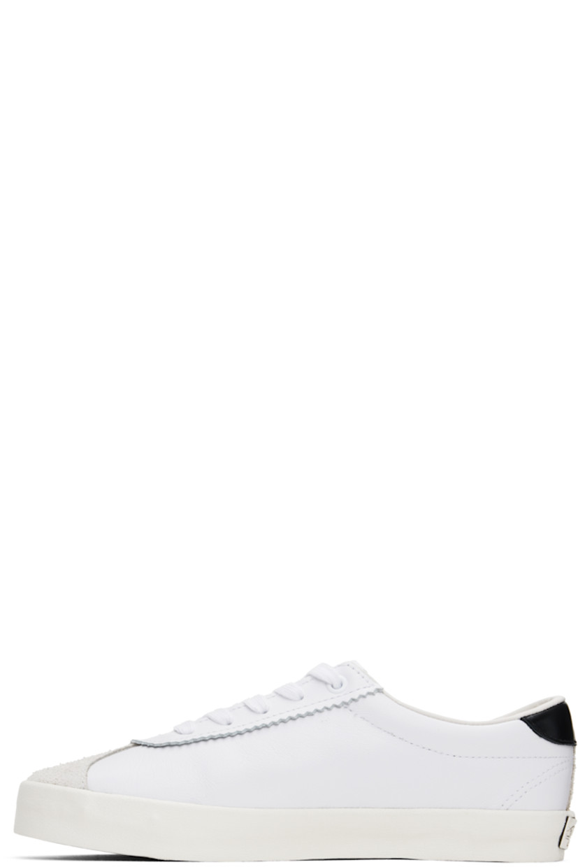 Low-top suede and buffed leather sneakers in white.

· Serrated detailing at lace-up closure
· Logo patch at padded tongue
· Grained leather Sidestripe™ at outer side
· Padded Sola ADC foam footbed
· Grained leather lining
· Rubberized logo patch at heel
· Treaded rubber sole

Supplier color: Black