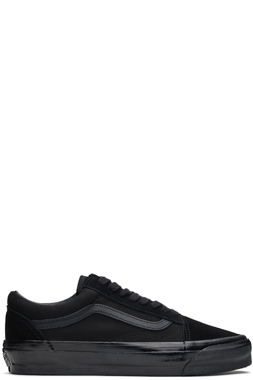 Low-top 8 oz canvas and suede sneakers in black.

· Lace-up closure
· Padded tongue and collar
· Grained leather Sidestripe™ at sides
· Padded Sola ADC foam footbed
· Grained leather and canvas lining
· Rubberized logo patch at heel
· Treaded rubber sole

Supplier color: Black/Black