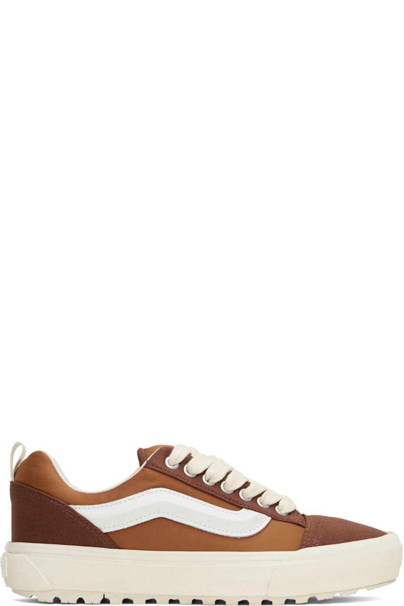 Low-top Primaloft®-insulated canvas and taffeta sneakers in brown.

· Lace-up closure
· Logo patch at padded tongue
· Padded collar
· Molded grained leather Sidestripe™
· Pull-loop at heel
· Padded insole
· Buffed leather lining
· Rubberized logo patch at heel midsole
· Lugged rubber sole

Supplier color: Mercer tortoise shell