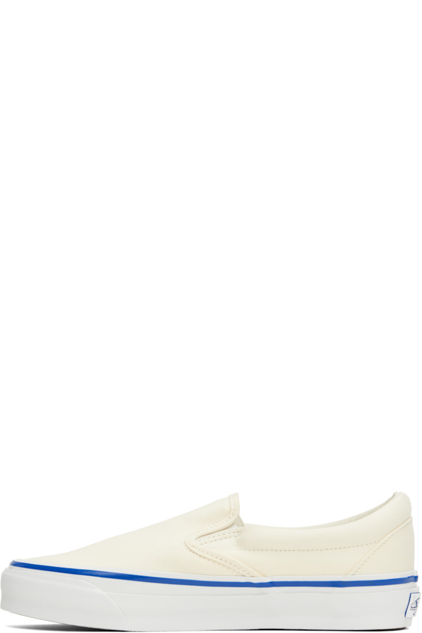 Low-top 8 oz canvas slip-on sneakers in off-white.

· Elasticized gussets at vamp
· Padded collar
· Logo flag at outer side
· Rubber logo patch at heel
· Partial grained leather and canvas lining
· Textured rubber midsole
· Treaded rubber sole

Supplier color: Lx off white