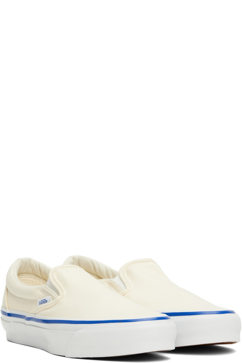 Low-top 8 oz canvas slip-on sneakers in off-white.

· Elasticized gussets at vamp
· Padded collar
· Logo flag at outer side
· Rubber logo patch at heel
· Partial grained leather and canvas lining
· Textured rubber midsole
· Treaded rubber sole

Supplier color: Lx off white