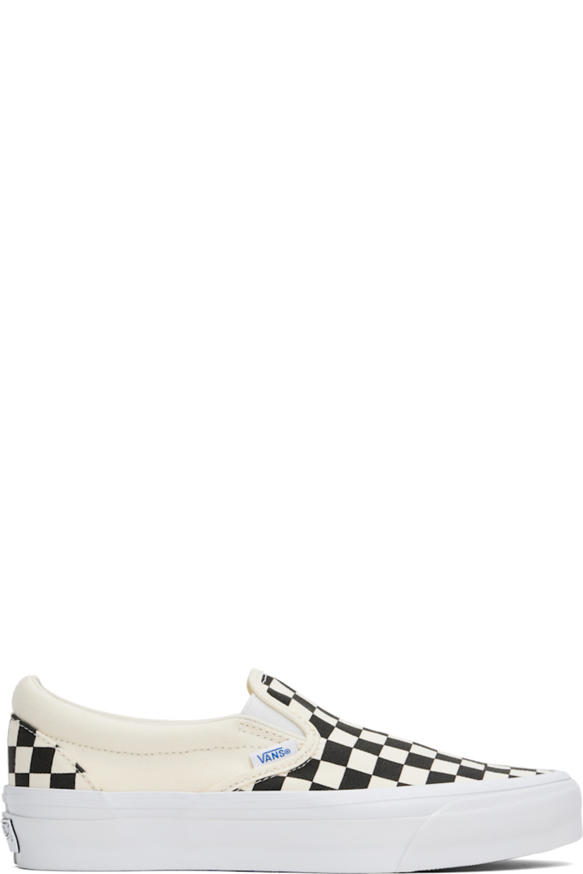Low-top 8 oz canvas slip-on sneakers in black and white.

· Screen-printed check pattern throughout
· Elasticized gussets at tongue
· Padded collar
· Logo flag at outer side
· Padded Sola ADC foam footbed
· Grained leather lining
· Rubberized logo patch at heel midsole
· Treaded rubber sole

Supplier color: Checkerboard/Black/White