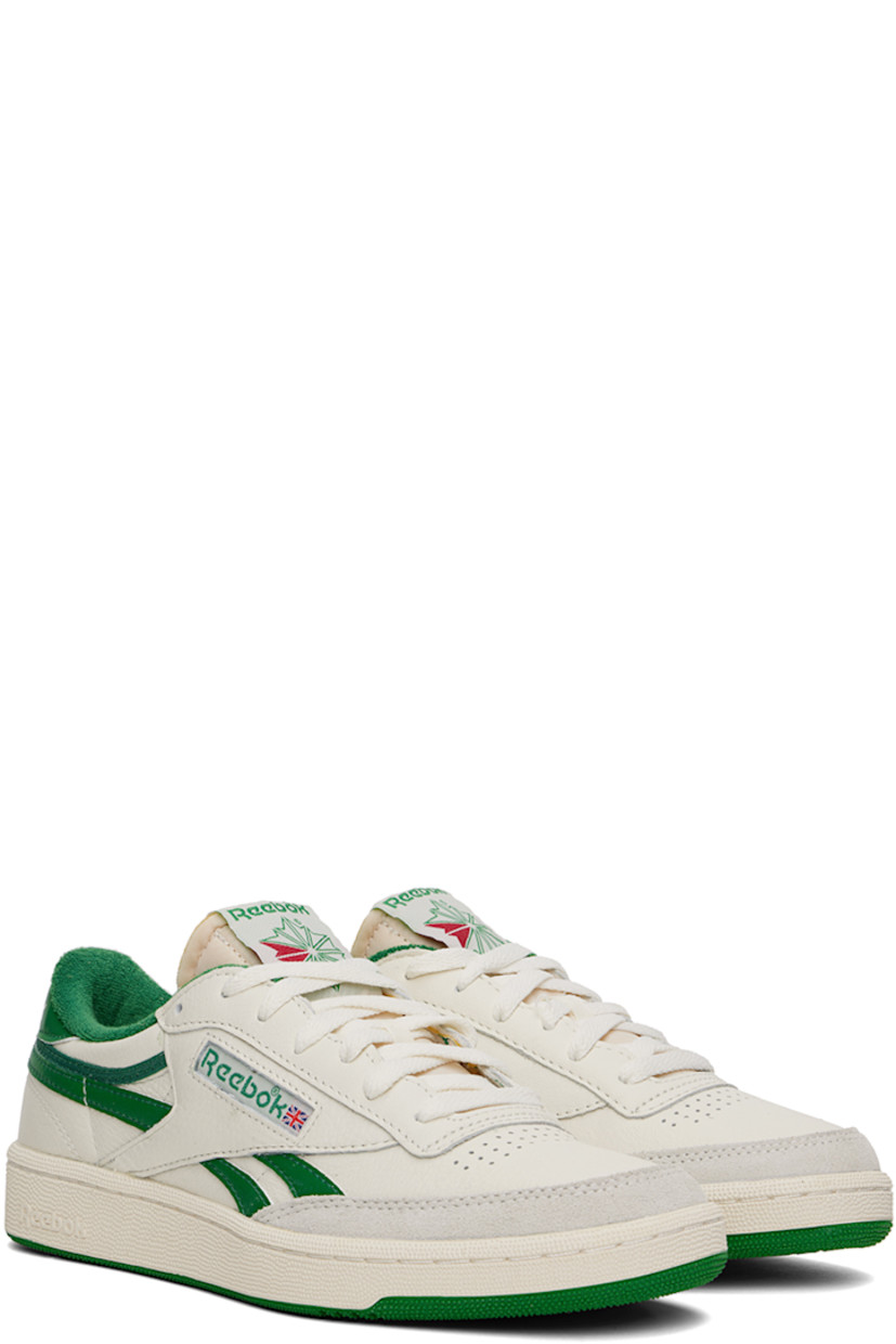 Low-top grained leather sneakers in off-white and green.

· Perforated detailing at toe
· Lace-up closure
· Logo patch at padded tongue
· Padded collar
· Inset logo patch at outer side
· Signature stripes at sides
· Logo embroidered at heel tab
· Terrycloth lining
· Treaded rubber sole

Supplier color: Chalk/Papwht/Glegrn