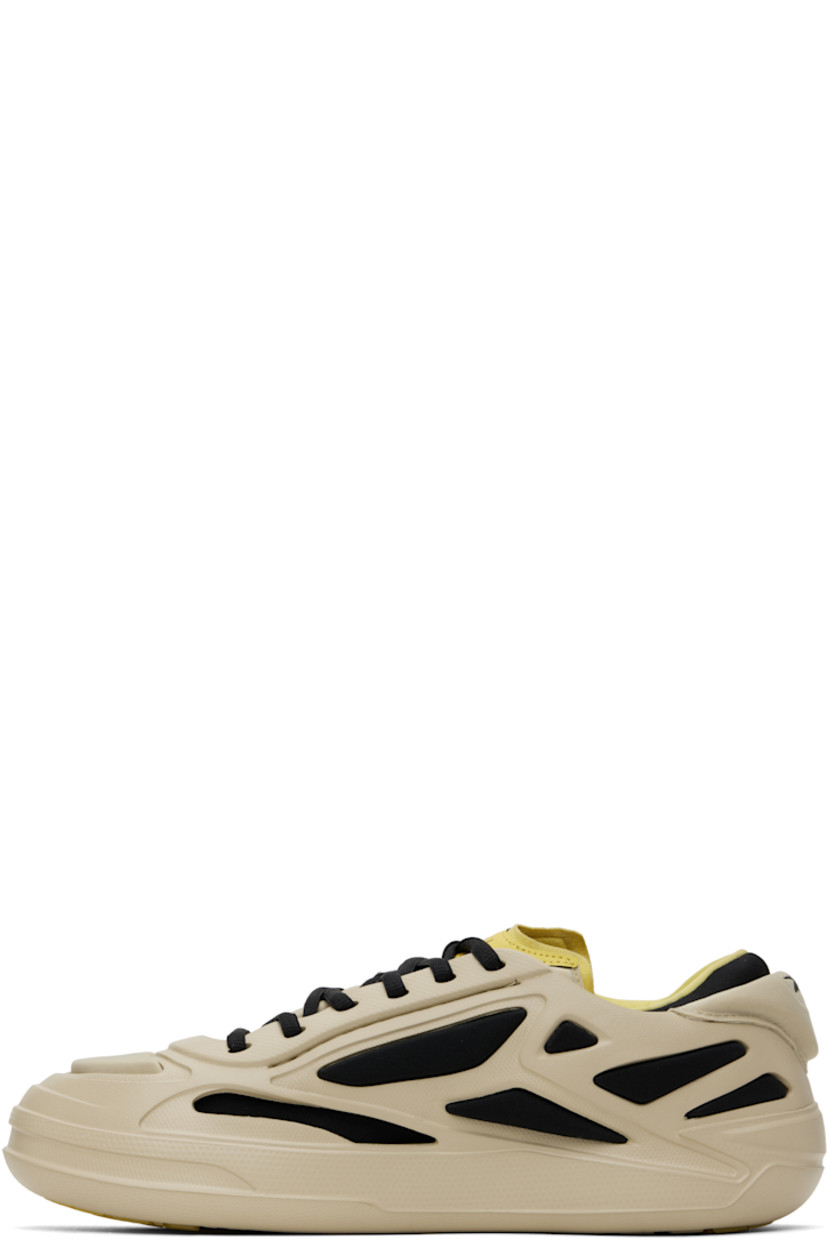 Low-top layered textured rubber and jersey sneakers in khaki and black. 

· Lace-up closure
· Padded collar
· Logo printed at heel tab and outer side
· Jersey lining
· Treaded rubber sole

Supplier color: Kakhi/Caviar