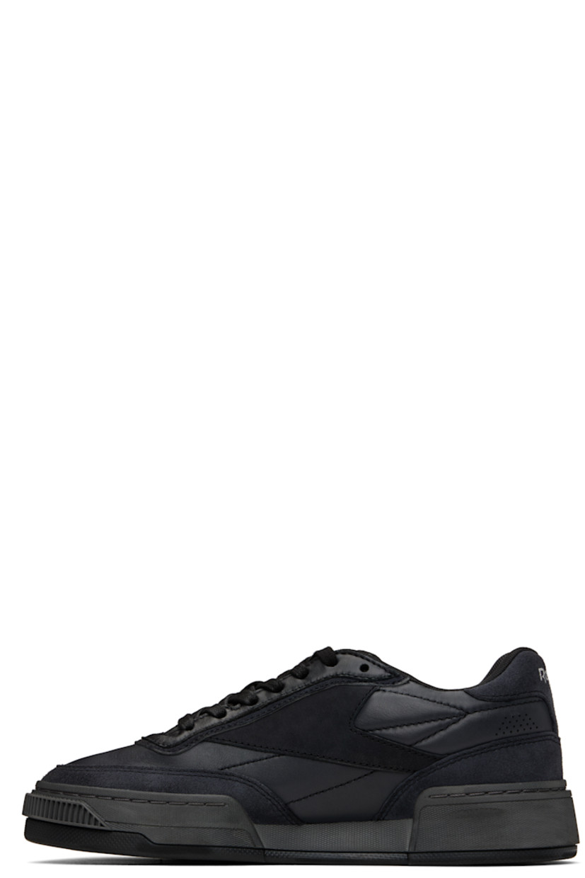 Low-top buffed leather sneakers in black. 

· Perforated detailing at toe and heel
· Lace-up closure
· Logo embossed at padded tongue
· Padded collar
· Logo flag at outer side
· Logo printed at heel tab
· Treaded rubber sole

Supplier color: Wax black