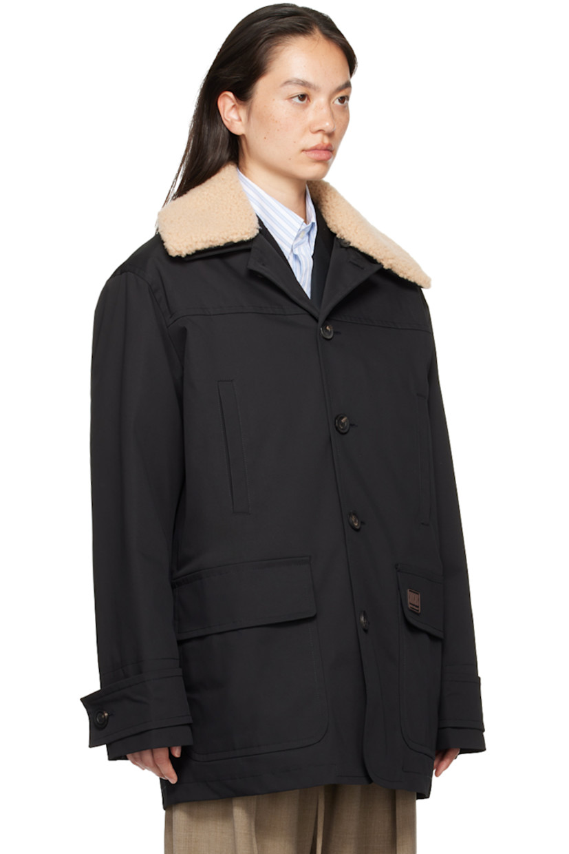 Nylon drill jacket. 

· Detachable shearling trim at spread collar
· Button closure
· Welt pockets at chest
· Rubberized logo patch at front
· Flap pockets
· Adjustable button tab at cuffs
· Welt pocket at interior 
· Full quilted satin lining 

Supplier color: Black/Ivory