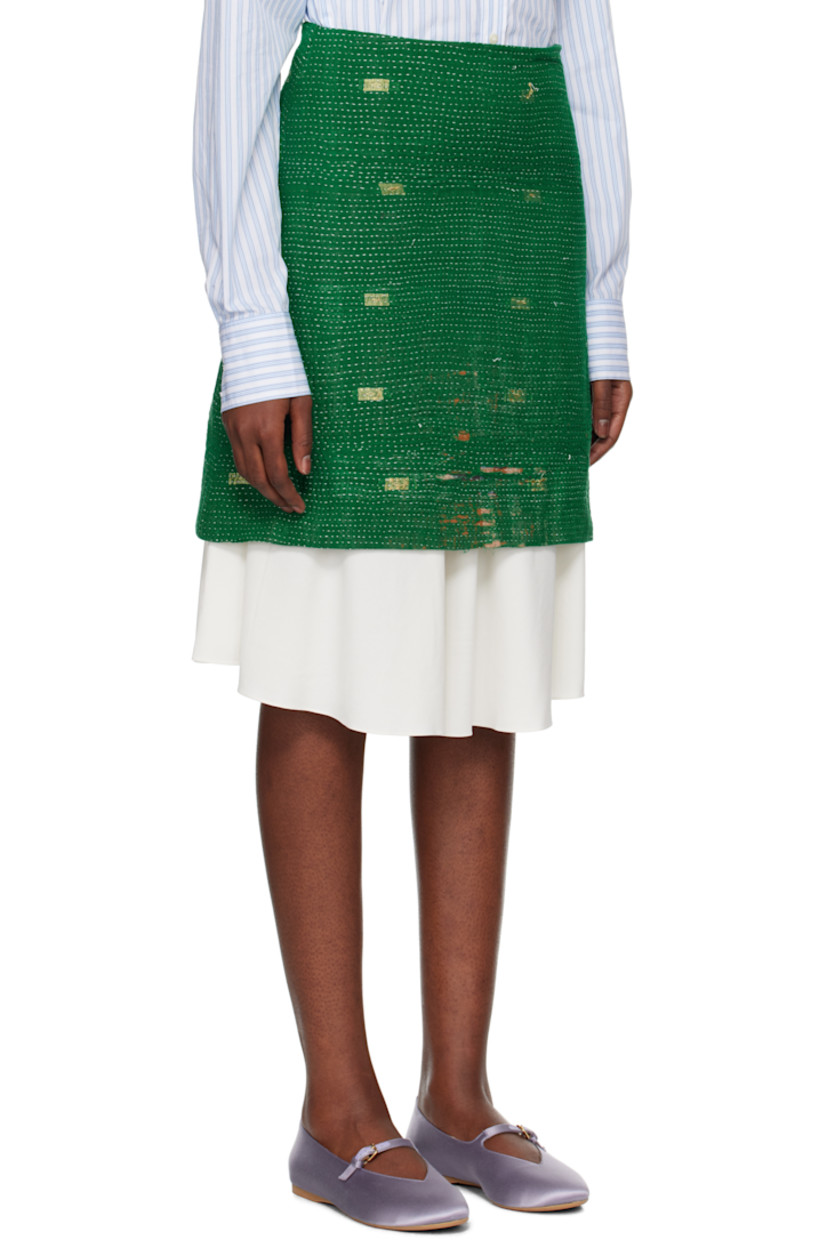 Handcrafted plain-woven cotton midi skirt. Embroidered detailing and graphic pattern throughout.

· Layered construction
· Zip closure at side seam
· Full plain-woven silk lining

Each item is unique. Please note that coloration may vary.

Supplier color: Green multi