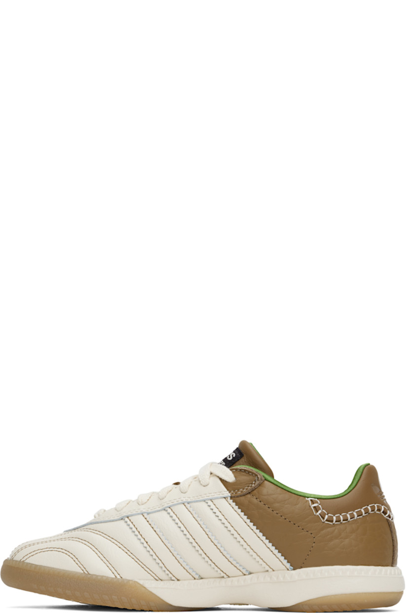 Low-top buffed leather and grained leather sneakers in off-white and brown.

· Logo stamp at vamp
· Lace-up closure
· Logo patch at padded tongue
· Padded collar
· Serrated signature stripes at sides
· Blanket stitching at logo-embossed heel tab
· Satin lining
· Foam rubber midsole
· Treaded Torsion System® rubber sole

Part of the Wales Bonner x adidas Originals collaboration.

Supplier color: Ivory/Sand