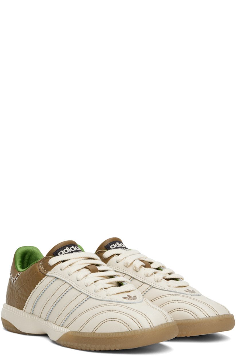 Low-top buffed leather and grained leather sneakers in off-white and brown.

· Logo stamp at vamp
· Lace-up closure
· Logo patch at padded tongue
· Padded collar
· Serrated signature stripes at sides
· Blanket stitching at logo-embossed heel tab
· Satin lining
· Foam rubber midsole
· Treaded Torsion System® rubber sole

Part of the Wales Bonner x adidas Originals collaboration.

Supplier color: Ivory/Sand