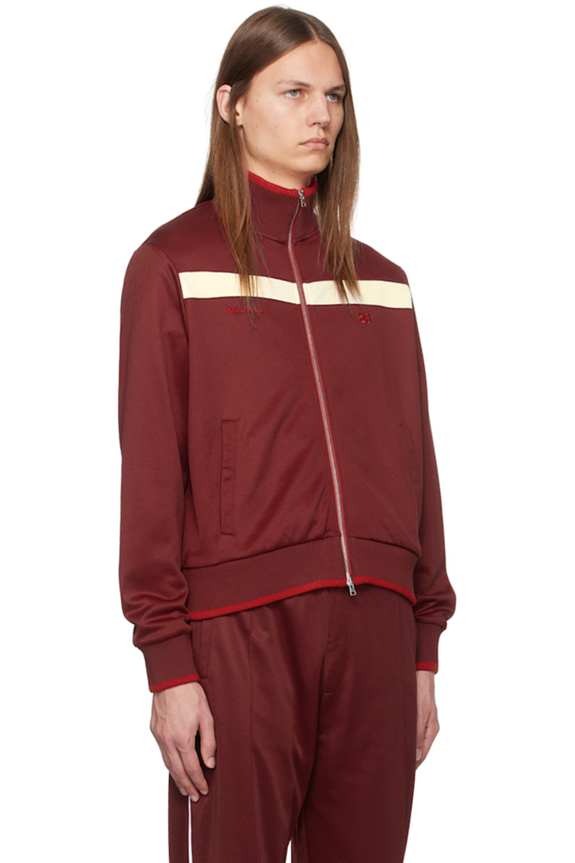 Plain-woven polyester- and cotton-blend track jacket.

· Rib knit stand collar, hem, and cuffs
· Two-way zip closure
· Stripe at front 
· Logo embroidered at chest
· Welt pockets

Supplier color: Burgundy red