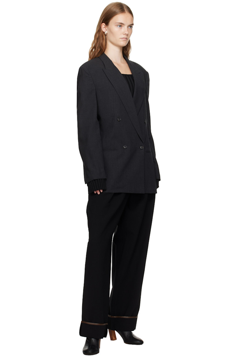 Wool delaine blazer. 

· Peaked lapel
· Double-breasted button closure
· Welt pocket and flap pockets
· Padded shoulders
· Vented cuffs 
· Twin vents at back hem 
· Full satin lining

Supplier color: Charcoal gray