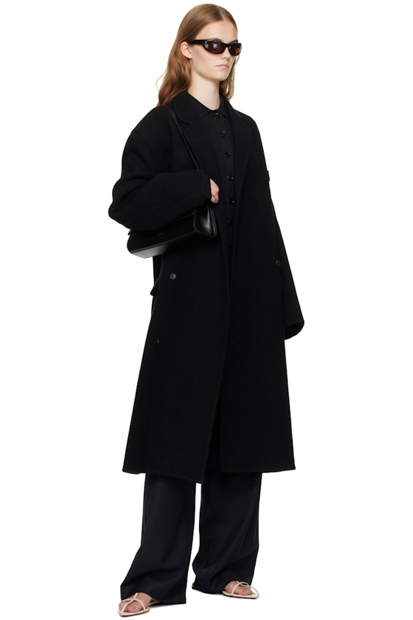 Rib knit rayon- and nylon-blend cardigan. 

· Modified spread collar
· Button closure at front and back
 
Supplier color: Black