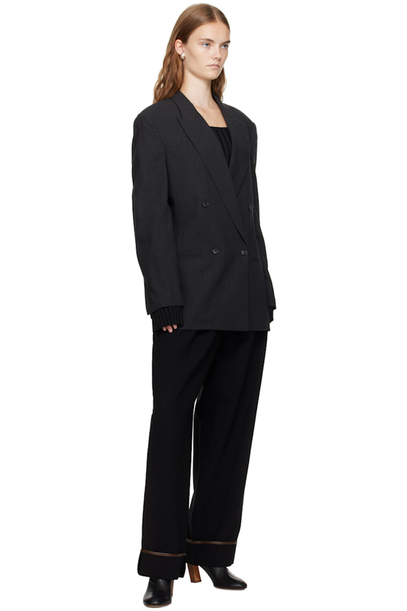 Rib knit rayon- and nylon-blend sweater. 

· Scoop neck
· Fixed shoulder straps
· Extended cuffs

Supplier color: Black