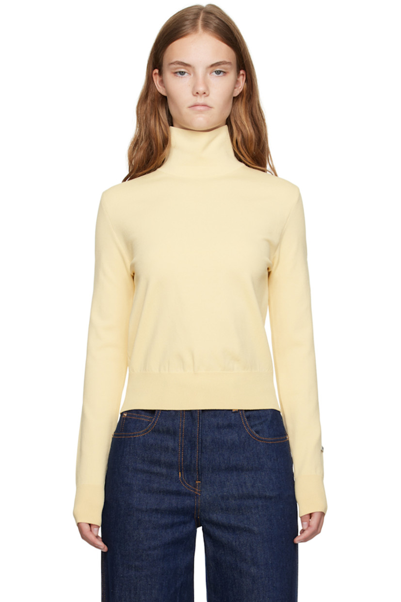Knit rayon- and nylon-blend turtleneck.

· Rib knit hem and cuffs 
· Logo patch at cuff

Supplier color: Butter beige