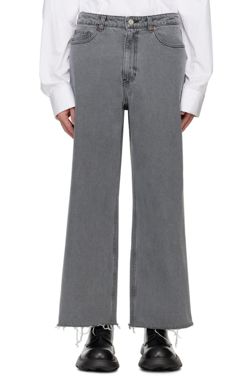 Wide-leg non-stretch denim jeans. Fading throughout.

· Low-rise
· Belt loops
· Five-pocket styling
· Zip-fly
· Frayed edge at cuffs
· Leather logo patch at back waistband
· Logo-engraved silver-tone hardware
· Contrast stitching in black

Supplier color: Grey