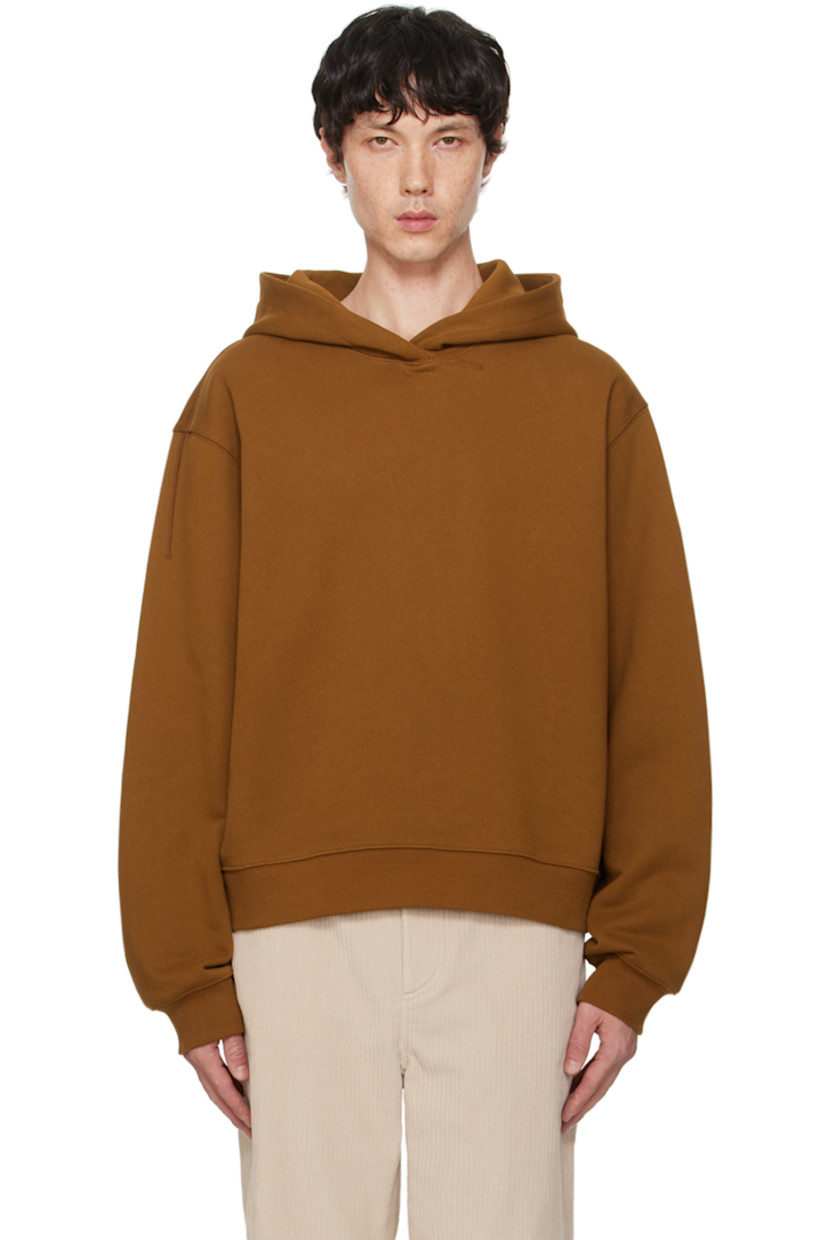 French terry hoodie.

· Rib knit hem and cuffs
· Dropped shoulders
· Logo embroidered at back hem

Supplier color: Brick brown
