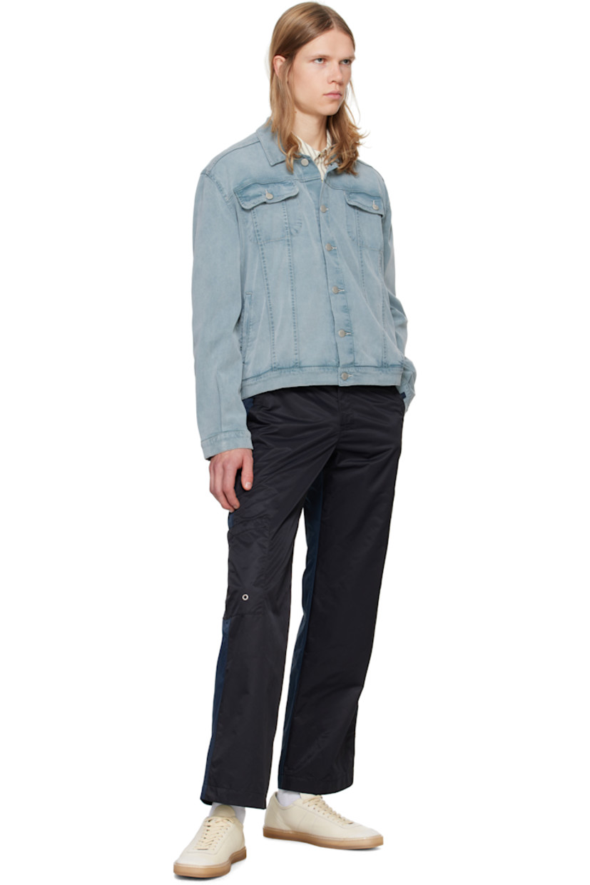 Stretch tencel- and cotton-blend denim jacket. Fading throughout.

· Spread collar
· Button closure
· Flap and welt pockets
· Single-button barrel cuffs
· Adjustable button tabs at back hem
· Silver-tone hardware
· Contrast stitching in white

Supplier color: Blue