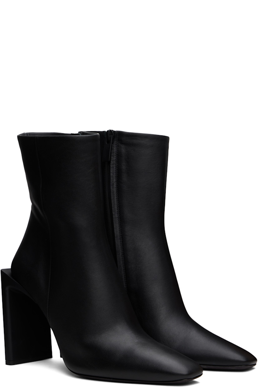 Ankle-high buffed calfskin boots in black.

· Pointed toe
· Zip closure at inner side 
· Buffed leather lining 
· Rubberized logo patch at heel
· Stacked block heel with rubber injection
· Leather sole with rubber injection
· Heel: H4"

Supplier color: Black